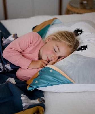girl 7 years old in pink pyjamas sleeping on pillowcase disko helps sleep peacefully through the night